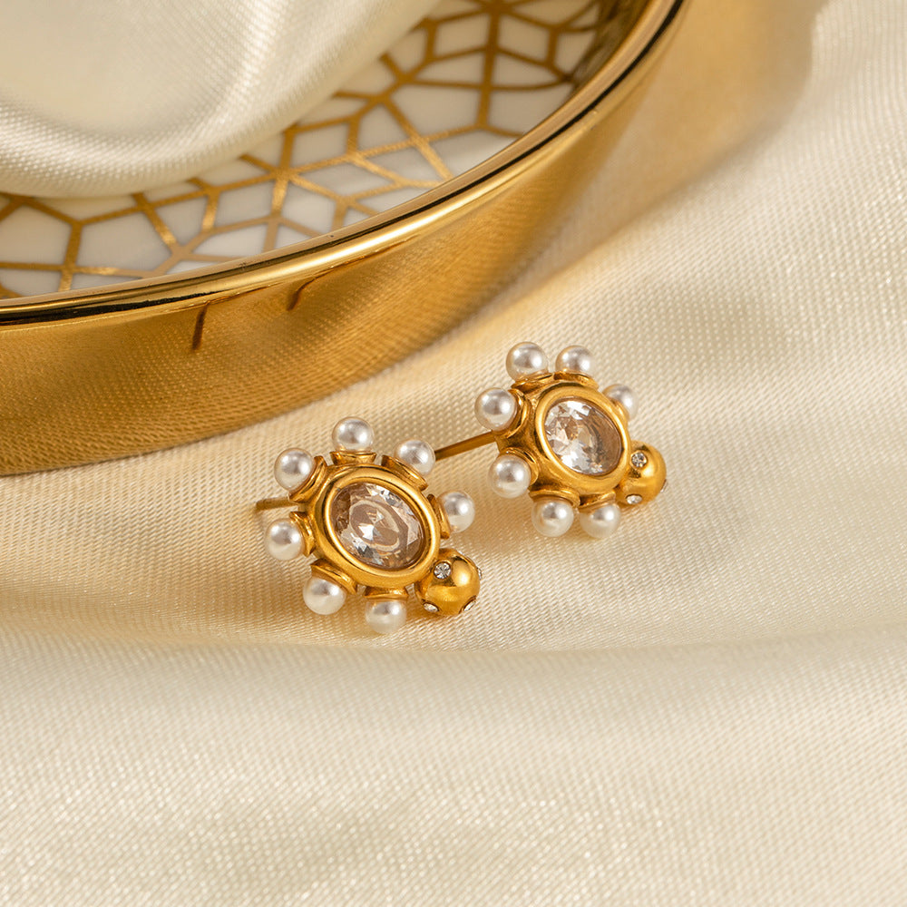 Elegante Goldohrringe mit Perle