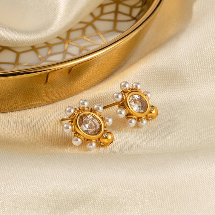 Elegante Goldohrringe mit Perle