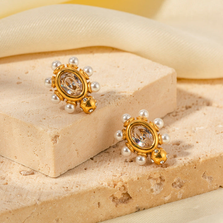 Elegante Goldohrringe mit Perle