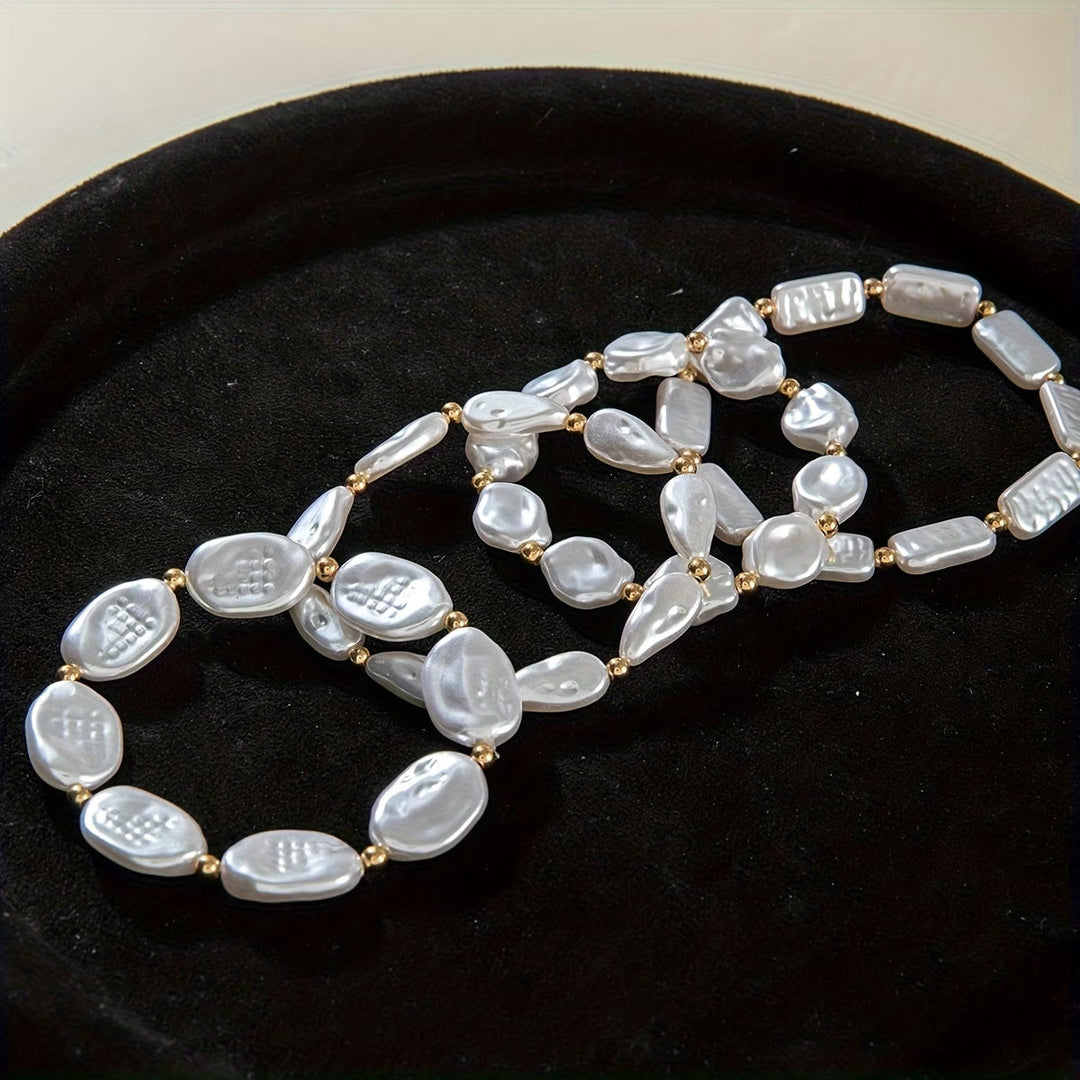 Set aus 4 Armbändern mit Perlen