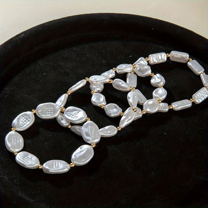 Set aus 4 Armbändern mit Perlen